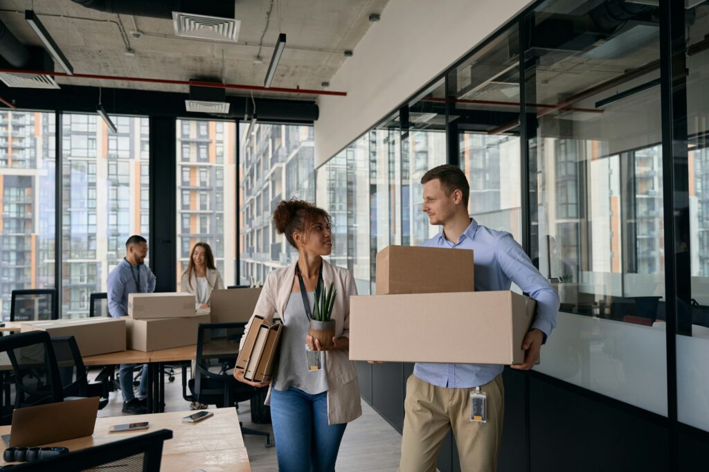 Young company employees preparing for office moving